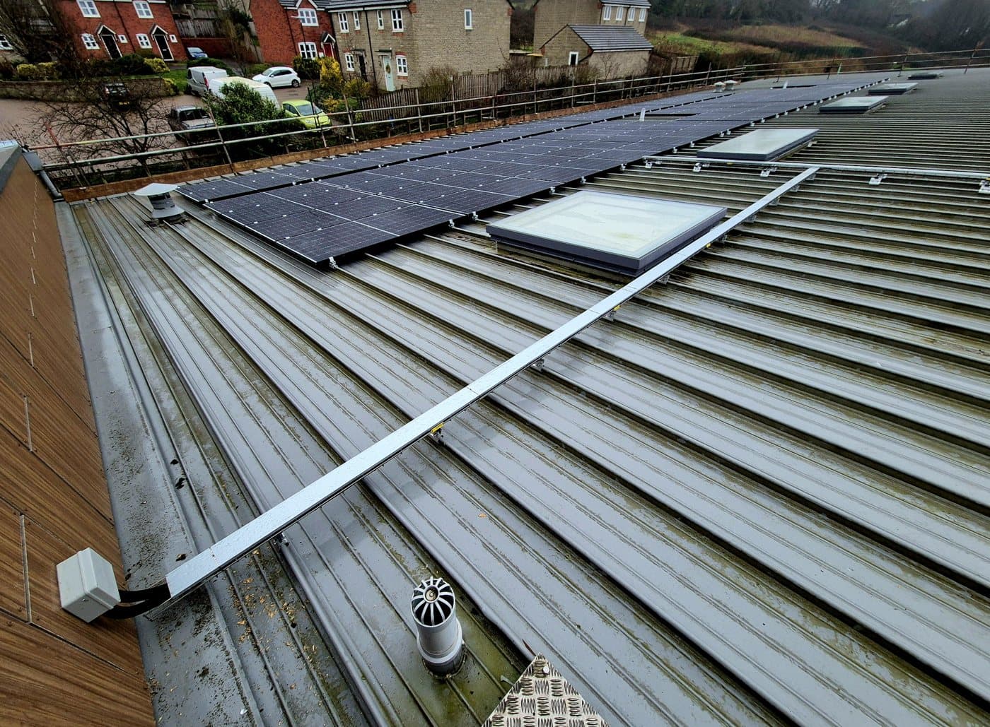 A neat rooftop cable route running to the array across a metal roof
