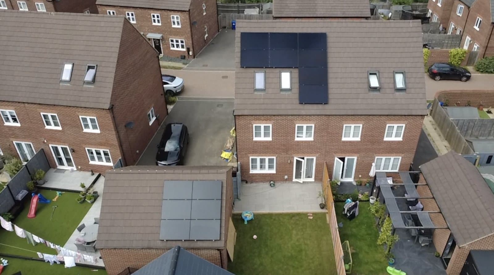 Drone view of panels on the house and garage roofs